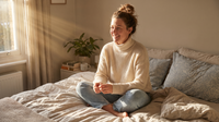 Woman sitting calmly in morning light