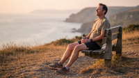 Man resting after a run at golden hour