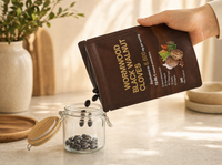 Wormwood Black Walnut Cloves softgels poured from the opened pouch into a glass jar